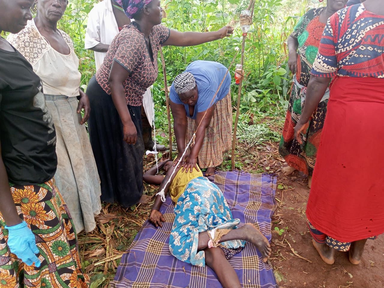 A BREFON community mental health outreach visit to a rural household in Northern Uganda.