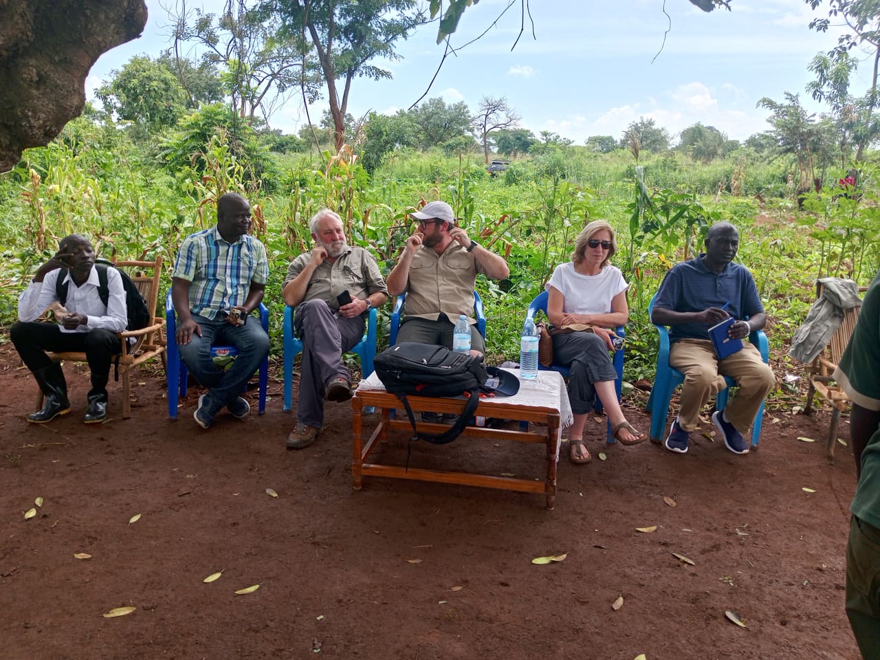 BREFON staff, district leaders and international partners meeting during a field visit.